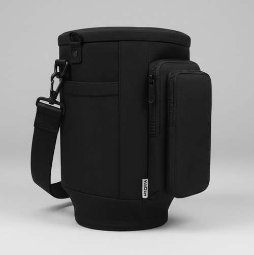 Black backpack with a shoulder strap on a light gray background